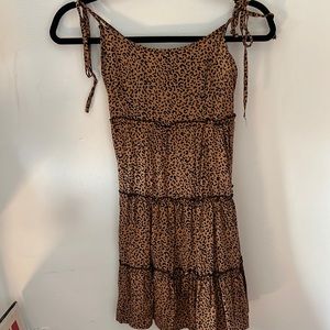 A size small cheetah sun dress. Never worn. Super cute.